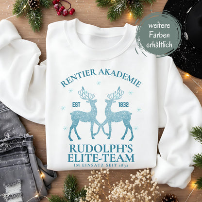 Weihnachtspullover „Rentier Akademie – Rudolph’s Elite-Team“ für Damen & Herren mit humorvollem Rentier-Motiv und Schneeflocken. Perfekter Winterpullover als Geschenkidee für Frauen und Männer, ideal für Nikolaus, Weihnachtsmarkt, Advent & Weihnachtsfeier. Witziges Weihnachtsoutfit mit Rentieren, festlich & gemütlich – ein weihnachtliches Statement-Stück für Familie, Partnerlook, Wichtelrunden oder den festlichen Abend. Für Fans von Rudolph, Rentiere & Christmas Spirit!