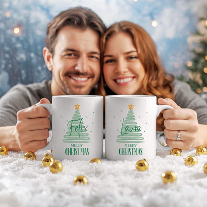 Personalisierbare Weihnachtstasse mit modernem Tannenbaum-Design in Mintgrün, verziert mit einem goldenen Stern und dem Schriftzug "Merry Christmas" – darunter individualisierbar mit Wunschnamen wie Felix oder Laura. Die Keramiktasse ist ein Geschenk zu Weihnachten für Freunde, Kinder, Partner oder Familie. Ideal als individuelles Weihnachtsgeschenk, Wichtelgeschenk oder festliche Wintertasse mit Namen – perfekt für die Adventszeit, Heiligabend oder als besondere Überraschung im Nikola