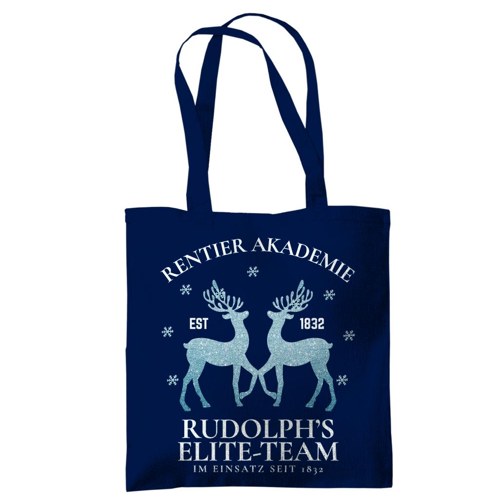 Weihnachtliche Stofftasche mit Rentier-Motiv „Rentier Akademie – Rudolph’s Elite-Team“ im Vintage-Stil. Ideale Baumwolltasche für Weihnachten, Einkäufe, Geschenke oder als nachhaltiger Jutebeutel. Perfekt als Geschenkidee oder als wiederverwendbare Geschenktasche mit Weihnachtsdesign. Waschbar, langlebig, mit langen Henkeln – als Weihnachtsgeschenktasche, Stoffbeutel oder Einkaufstasche nutzbar. Ideal für Damen, Herren oder Kinder zur Weihnachtszeit. Farben: Natur, Blau, Schwarz.